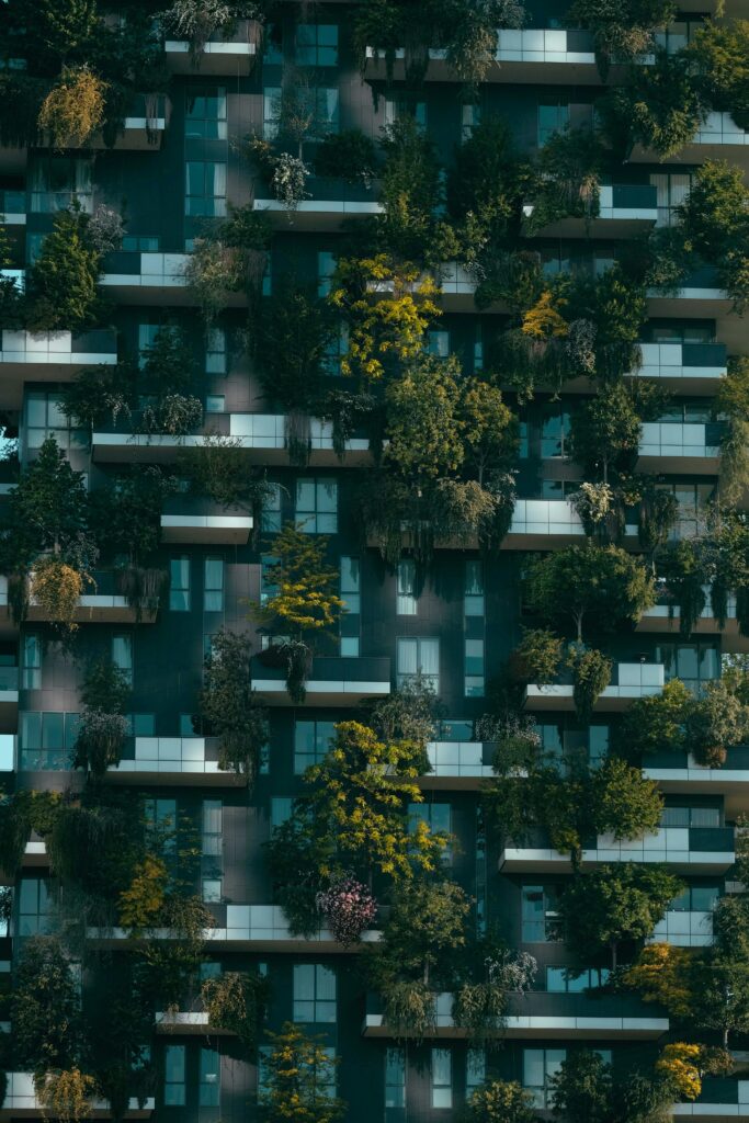 Modern residential building facade decorated with green plants